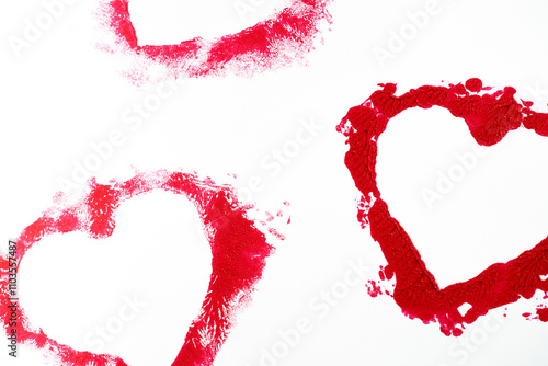 Isolated red lipstick smudge smear heart shaped. Cream makeup texture, cosmetics for Valentine's photo