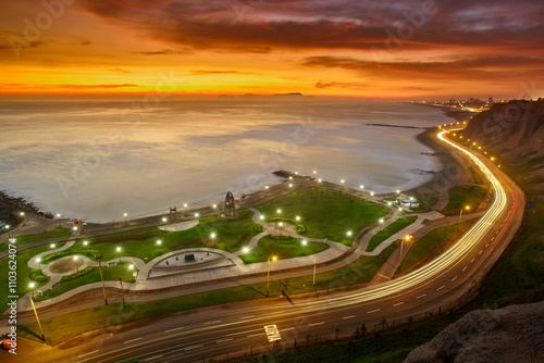 La Costa Verde under the night sky.The city lights dance along the coast, waves softened into mist with the long exposure, creating a dreamscape that feels otherworldly. Miraflores Lima Peru photo