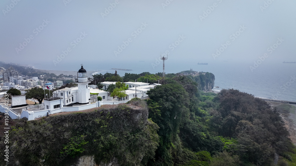 A panoramic view of the Kaohsiung lighthouse on a foggy day by the coast in Taiwan A panoramic view of the Kaohsiung lighthouse on a foggy day by the coast in Taiwan