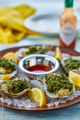 oysters rockafeller made with spinach, parsley, and garlic cream sauce photo