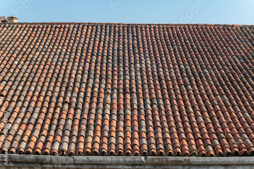 tiles of historic building, the large pitches of the sleeves of the and factories of the venice arsenal home to part of the biennial, imposing roofs with historic tiles. maintenance for infiltrations. photo