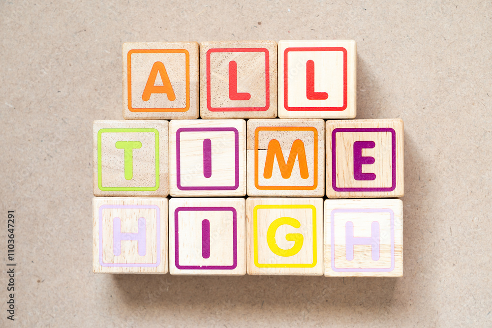 Alphabet letter block in word all time high on wood background Alphabet letter block in word all time high on wood background