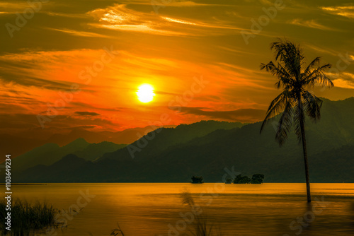 Obraz na płótnie In sunset hour,beautiful mountain scenery silhouette
,colorful sky cloudscape and view of coconut tree in the lake form a scenic scene at Zengwen Reservoir after sunset, Tainan City, Taiwan. w salonie