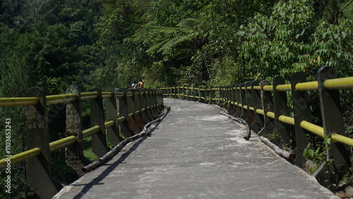 Portrait of the Plunyon Bridge over the Kalikuning river with beautiful and amazing views located on the slopes of Mount Merapi. photo