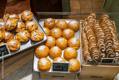 Photography Stockholm, Sweden An assortment of freshly baked saffron buns and pepparkakor in a bakery window