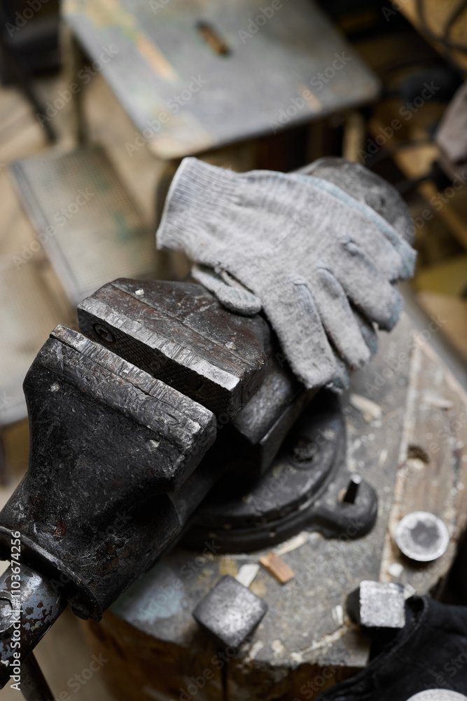 Explore various workshop tools and essential hand protection gear when working with a vise