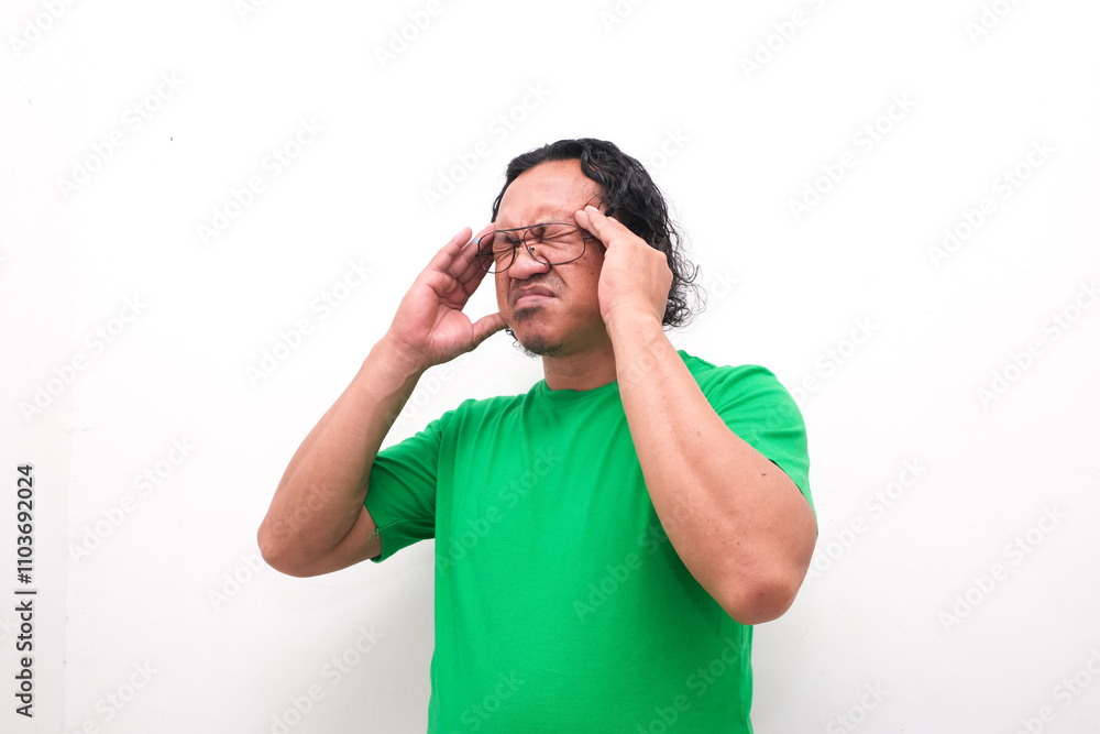 Asian man gesture who is feeling headache or migraine and vertigo isolated on white background Asian man gesture who is feeling headache or migraine and vertigo isolated on white background