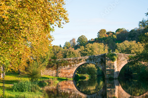 medieval bridge in Allariz over River Arnoia at evening. Ourense, Galicia. Spain photo