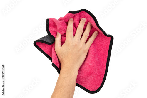 Human hand holding pink rag and wiping table or cleaning something isolated on white background with clipping path.