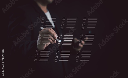 Document Management System (DMS) and task management. assessment forms, questionnaires, checklists,efficient task tracking. Businessman using laptop for checklist, and filling out a survey form online