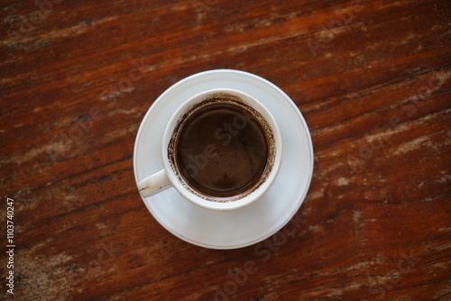 cup of coffee on wooden table