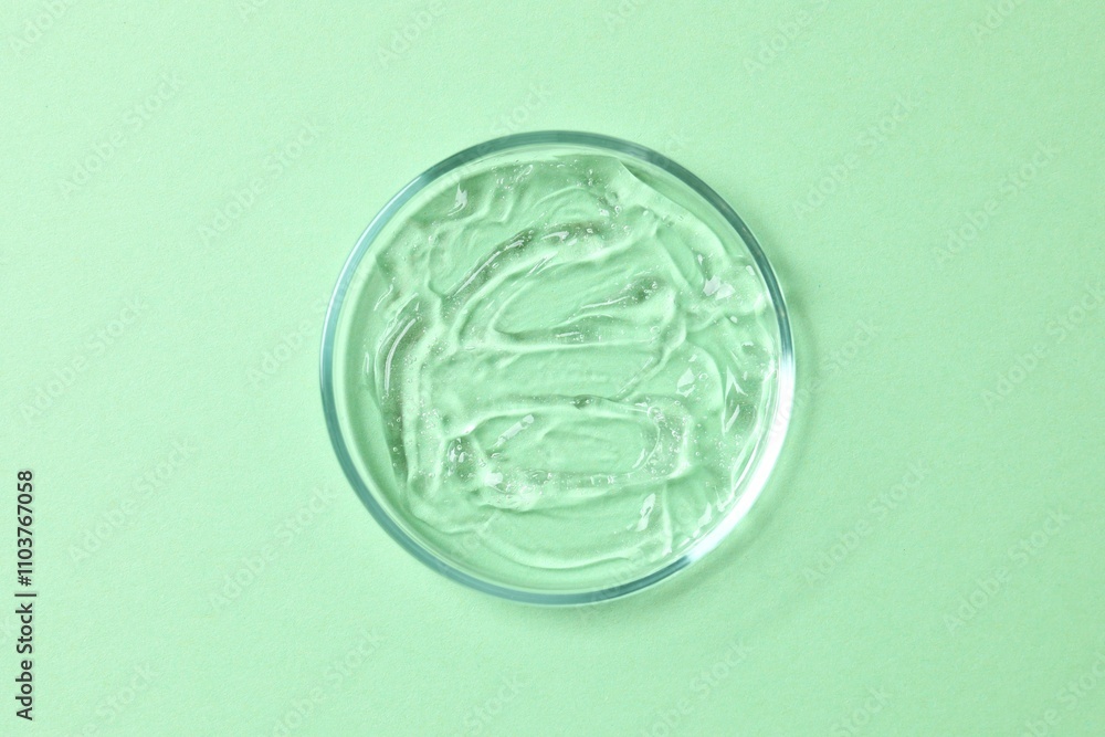 Petri dish, cosmetic gel swatches with aloe on white background, copy space. Bio science research, biochemistry, organic skin care concept Petri dish, cosmetic gel swatches with aloe on white background, copy space. Bio science research, biochemistry, organic skin care concept