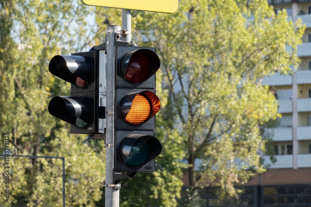 Traffic lights with orange light on, bokeh