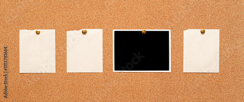 Blank paper notes and an empty photo are pinned to a cork board. The concept of detective investigation.