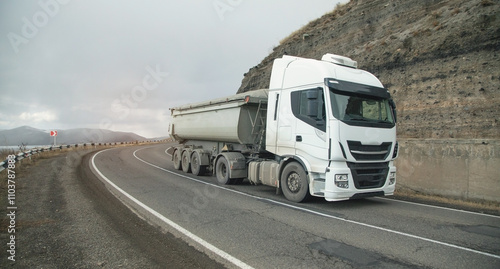 Truck driving at the highways. Transportation. Delivery