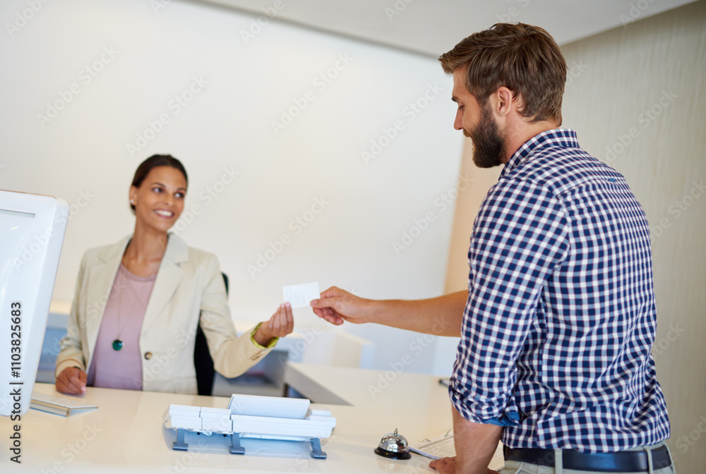 Fototapeta premium Receptionist, man and card for sign in, welcome and help desk with friendly service. Happy people, traveler and employee with room documents, hospitality or holiday with hotel, lodge and vacation