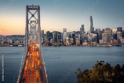 Obraz na płótnie the oakland bay bridge and the skyline of san franciso during sunrise w salonie