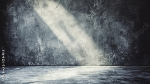 Dramatic light beams illuminate a textured concrete wall and floor, creating a moody atmosphere.