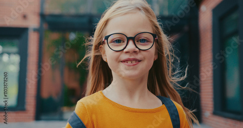 Wallpaper Mural Portrait of cute Caucasian girl Looking directly while smiling. Happy about leaving school. Finishing studying for day. Wearing glasses, colorful sweater and backpack. Torontodigital.ca