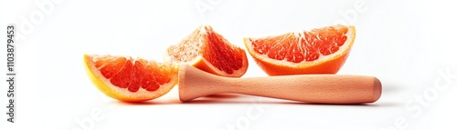 Sliced grapefruit on white background with a wooden juicer. photo