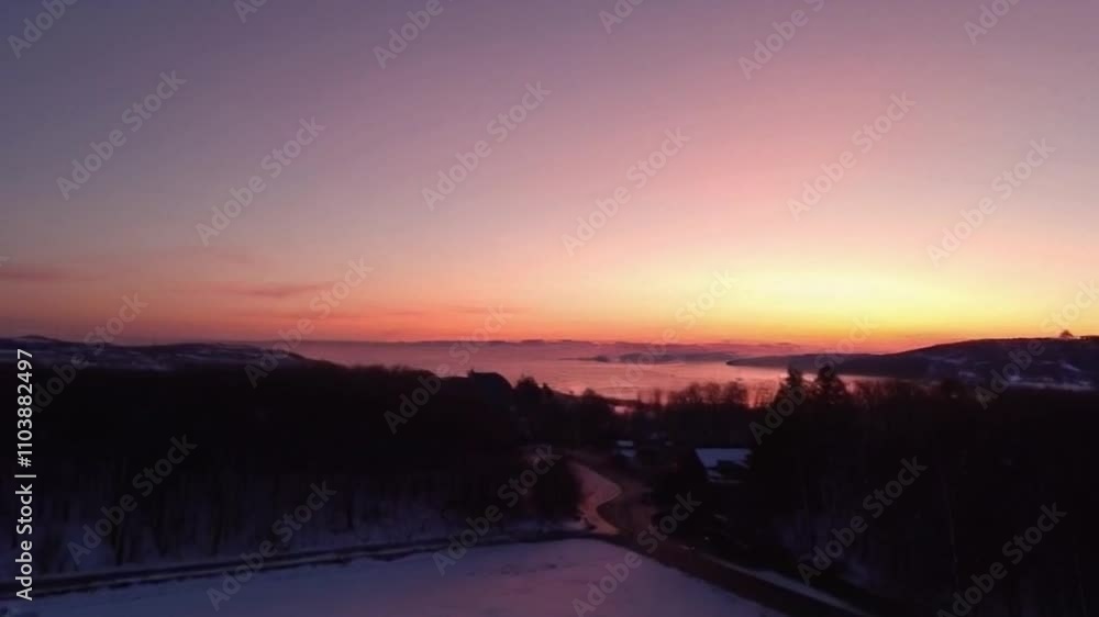 Tranquil twilight sky over snowy field and winter forest, serene and awesome inspiring tree silhouette. Tranquil twilight sky over snowy field and winter forest, serene and awesome inspiring tree silhouette.