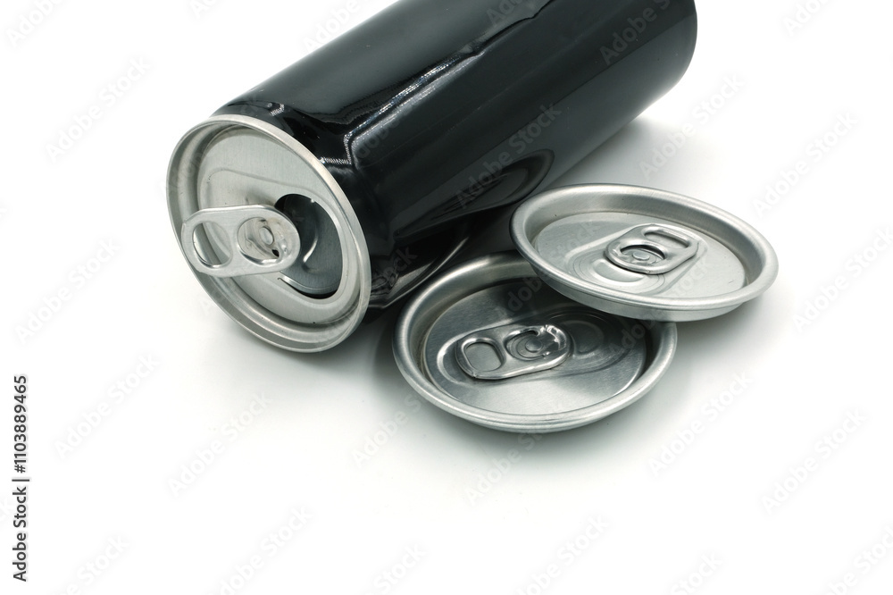 Black cans and caps of soda cans on white background, recycled material concept. Black cans and caps of soda cans on white background, recycled material concept.