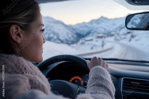 A woman skillfully maneuvers her car on a winding snowy road while surrounded by stunning mountains, capturing the essence of winter exploration and the thrill of driving.