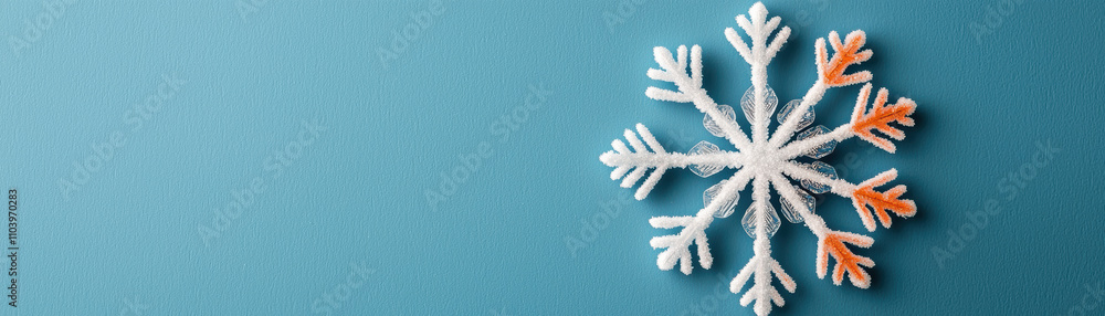 A delicate snowflake with intricate patterns against a blue background, highlighting winter's beauty and seasonal charm. A delicate snowflake with intricate patterns against a blue background, highlighting winter's beauty and seasonal charm.