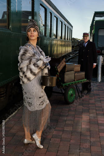 1920s lady at train station photo