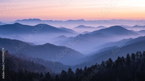 Serene mountains shrouded in mist during twilight, showcasing natural beauty and tranquility.