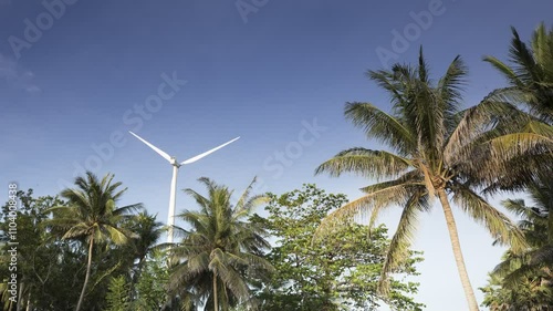 A turbines  of solar panels with wind rotating on mountains landscape under cloudy sky