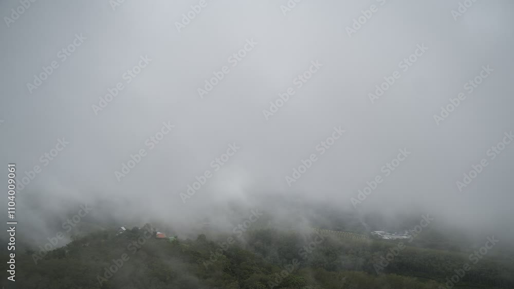 A cloudy of foggy landscape view on top view of mountain at sunrise timing in winter season A cloudy of foggy landscape view on top view of mountain at sunrise timing in winter season