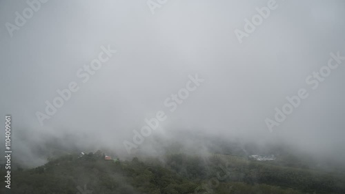 A cloudy of foggy landscape view on top view of mountain at sunrise timing in winter season