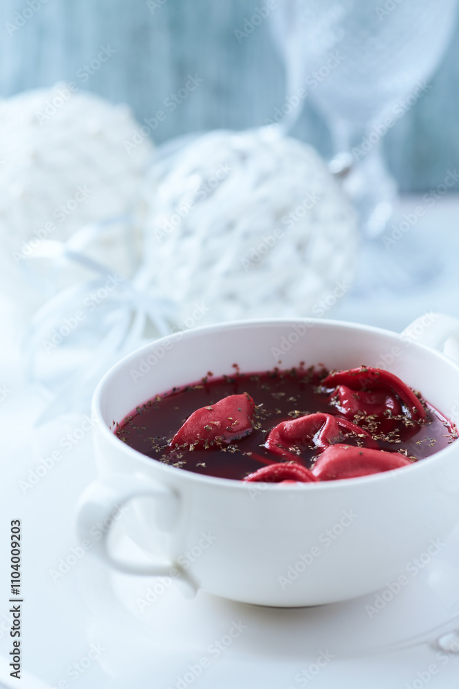 Traditional Christmas Borscht (Barszcz) with mushroom dumplings on bright background. Traditional Christmas Borscht (Barszcz) with mushroom dumplings on bright background.
