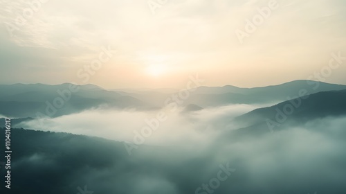 Serene Sunrise Over Misty Mountain Ranges