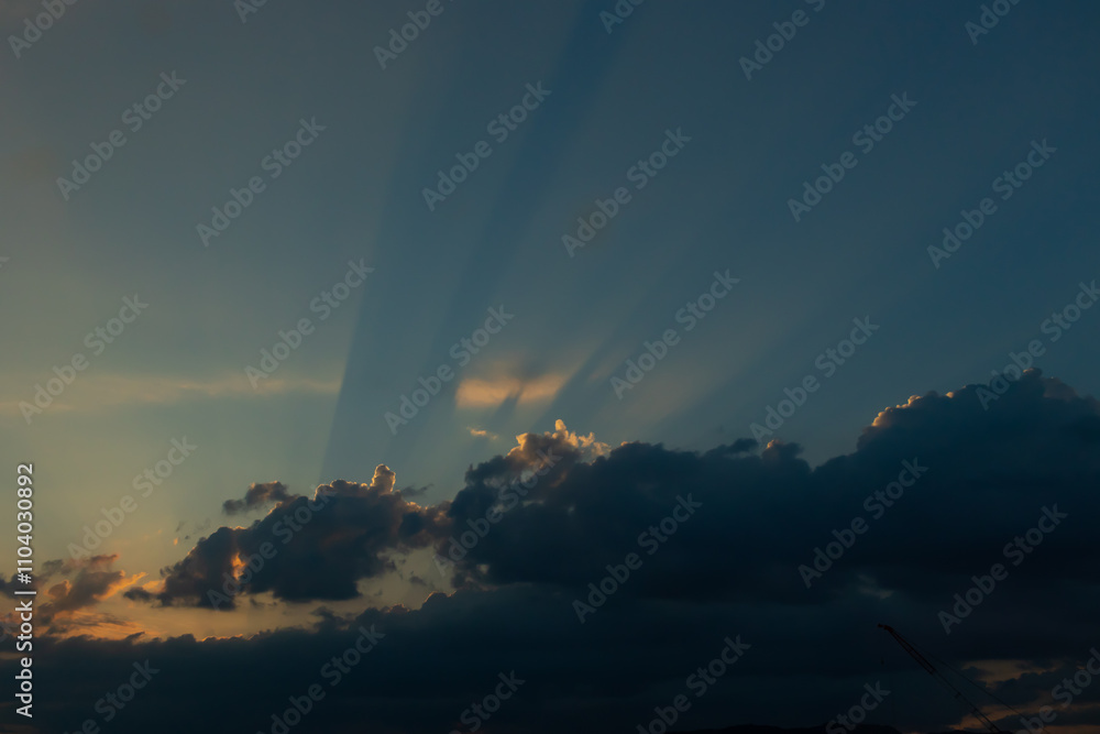 This is such a beautiful image of rays shooting out from the clouds. The sun is seen here beaming its light for all to see. A pretty clear blue sky is here. This is such a beautiful image of rays shooting out from the clouds. The sun is seen here beaming its light for all to see. A pretty clear blue sky is here.