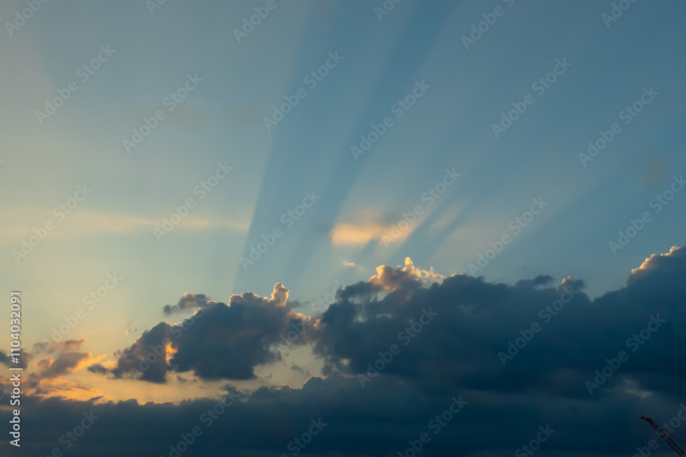 This is such a beautiful image of rays shooting out from the clouds. The sun is seen here beaming its light for all to see. A pretty clear blue sky is here. This is such a beautiful image of rays shooting out from the clouds. The sun is seen here beaming its light for all to see. A pretty clear blue sky is here.