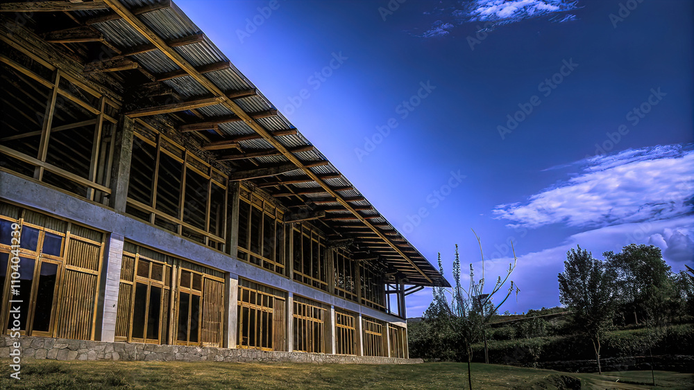 Fototapeta premium A calm, stable school located in a lush green landscape. ample natural light, with a smooth, organic design that encourages creativity, dynamism and interaction.