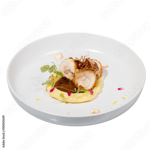 A beautifully presented dish featuring rolled chicken, creamy sauce, and garnishes, arranged artistically on a white plate.