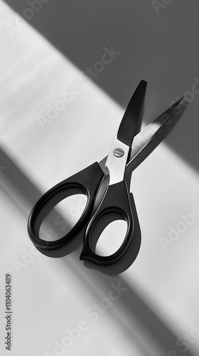 Modern Stainless Steel Scissors with Ergonomic Handles on a White Surface