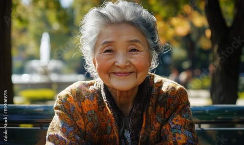 Elderly Woman Smiling in Sunlit Park Setting photo