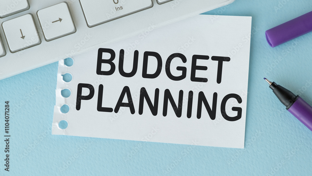 Naklejka premium On the desktop there are reports, notepads, a calculator, a cash and a yellow sticker with the text BUDGET PLANNING. Business concept