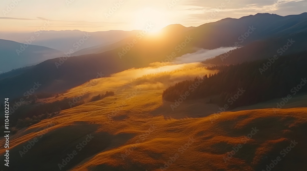 Fototapeta premium Golden Sunset Over Misty Mountain Ranges