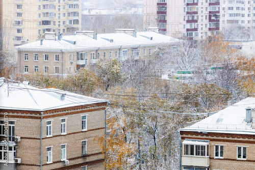 view of city block covered with the first snow photo