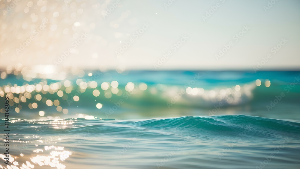 Sunrise over the waves with clear blue skies and a peaceful ocean horizon