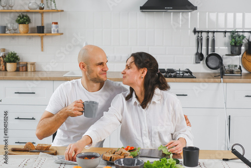 blind couple Enjoying Breakfast Together in Cozy Modern Kitchen photo