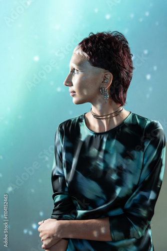 Futuristic woman with metallic makeup in a digital world photo