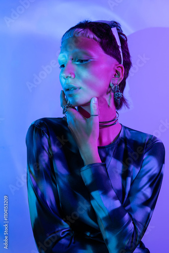 Futuristic woman with vibrant lighting in a metaverse-inspired setting photo