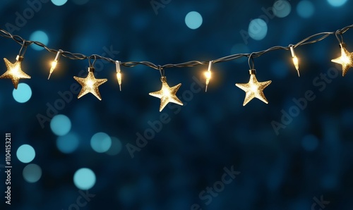 Christmas star string lights on blue night background with defocused bokeh; blue, white, gold colors 