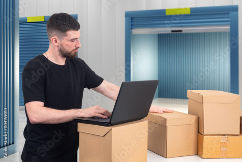Man with boxes stands near ...